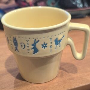 Yellow Ceramic Mug with Blue Animal Design
